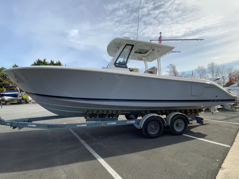 Slide: The Image of 2025 Pursuit S 288 Sport boat on trailer in parking lot. - 6