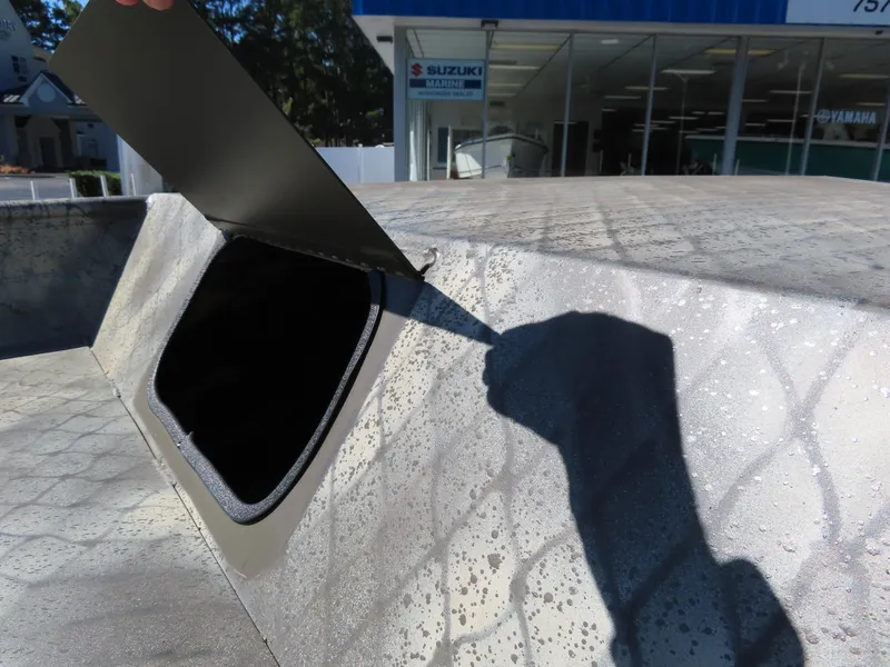 Slide: The Image of WeldBilt 1852 boat hatch open, showcasing interior, 2025 model. - 11