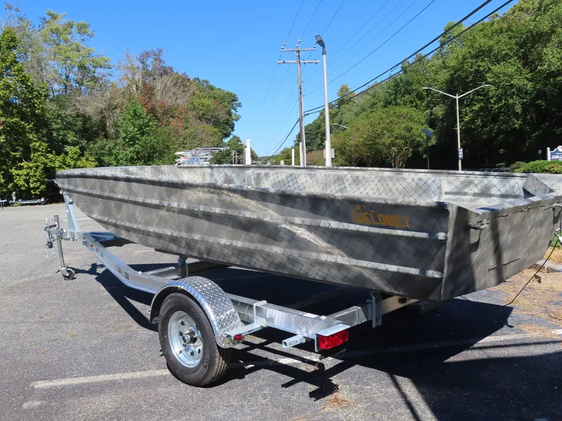 Slide: The Image of 2025 WeldBilt 1852 boat on trailer in sunny parking lot. - 2
