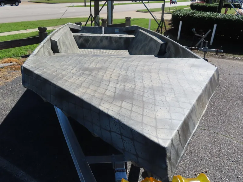 Slide: The Image of 2025 WeldBilt 1852 boat with textured surface on a trailer. - 3
