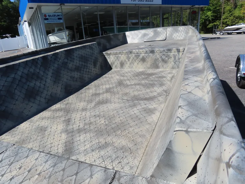 Slide: The Image of 2025 WeldBilt 1852 boat hull with textured surface, displayed outdoors. - 5