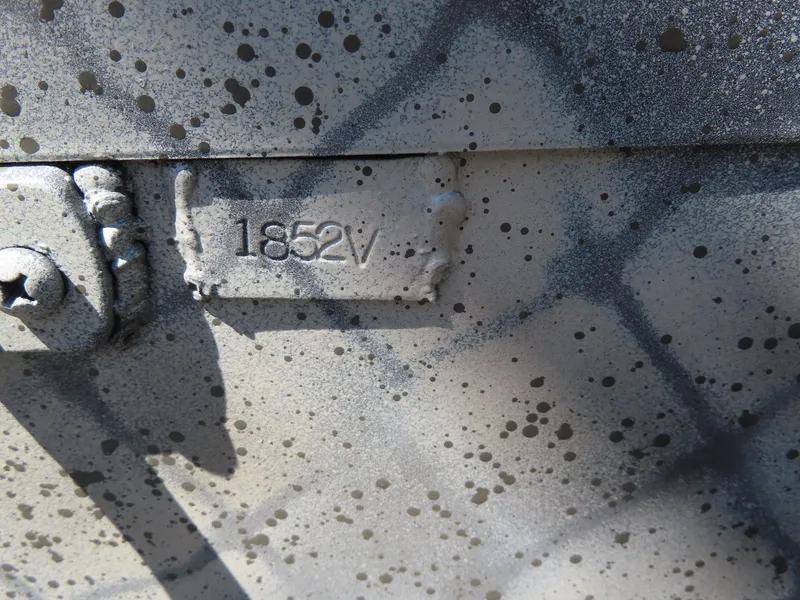 Slide: The Image of Close-up of WeldBilt 1852 model, 2025, with textured metal surface. - 8