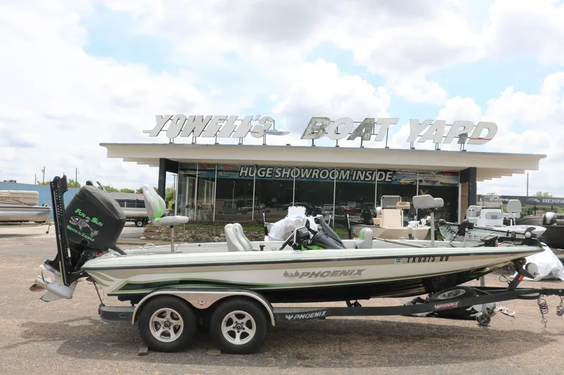 The Image of 2016 Phoenix 920 ProXP boat at Yowell's Boat Yard under clear blue sky. - 0