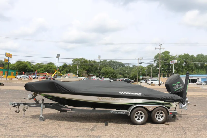 Slide: The Image of 2016 Phoenix 920 ProXP boat deck with logos and storage compartments. - 14