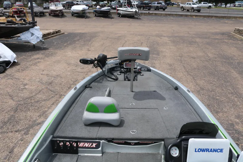 Slide: The Image of 2016 Phoenix 920 ProXP boat deck with Kistler branding, parked on asphalt. - 18