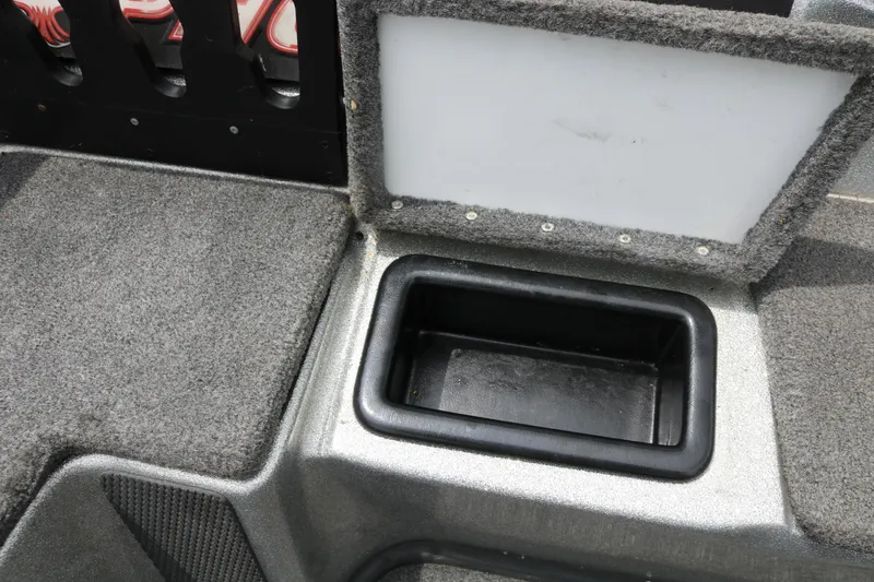 Slide: The Image of 2016 Phoenix 920 ProXP boat deck with storage compartments and motor. - 29