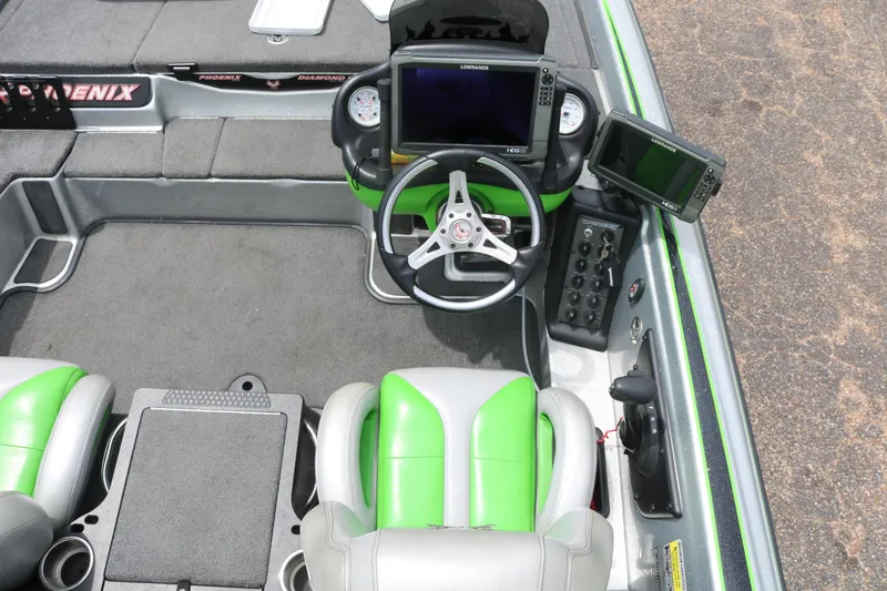 Slide: The Image of Open storage compartment on 2016 Phoenix 920 ProXP boat deck. - 34