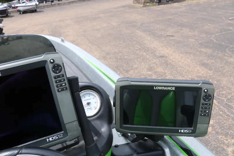Slide: The Image of 2016 Phoenix 920 ProXP boat interior with green seats and Lowrance electronics. - 37