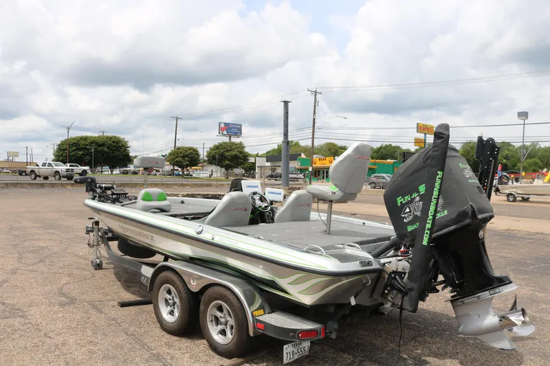 Slide: The Image of 2016 Phoenix 920 ProXP boat with Mercury engine on trailer in parking lot. - 4