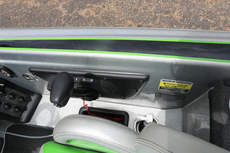 Slide: The Image of 2016 Phoenix 920 ProXP boat covered, parked in a dealership lot under clear blue sky. - 41