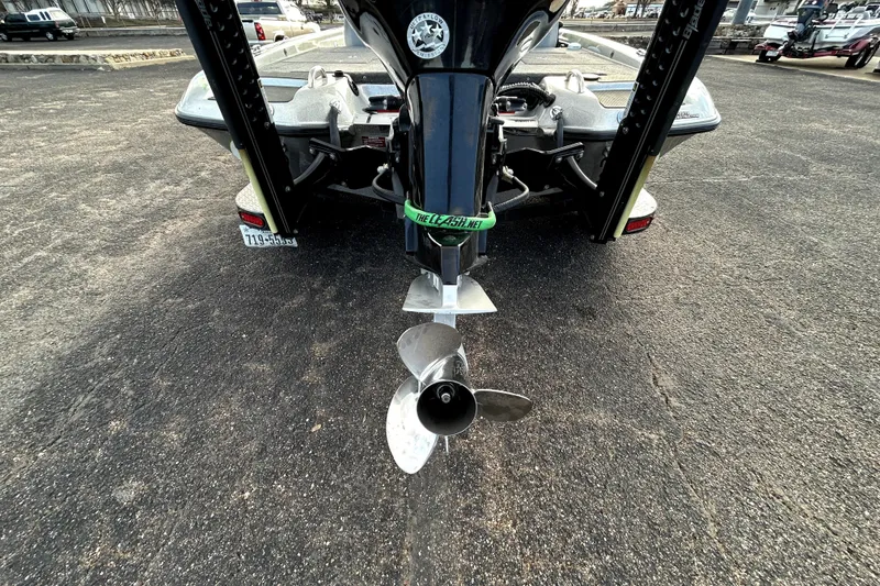 Slide: The Image of Rear view of 2016 Phoenix 920 ProXP boat with visible propeller and license plate. - 7