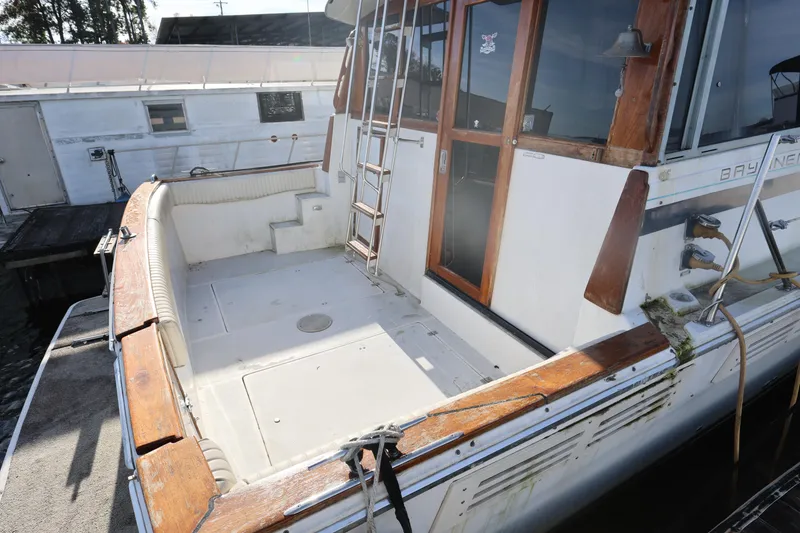 Slide: The Image of 1988 Bayliner 3818 Motoryacht with spacious deck and wooden accents. - 4