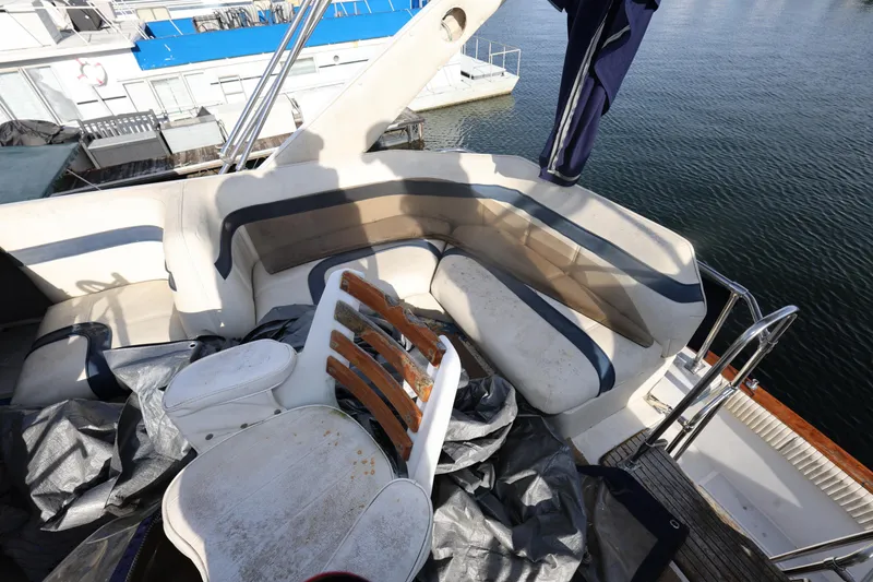 Slide: The Image of 1988 Bayliner 3818 Motoryacht deck with seating and water view. - 9