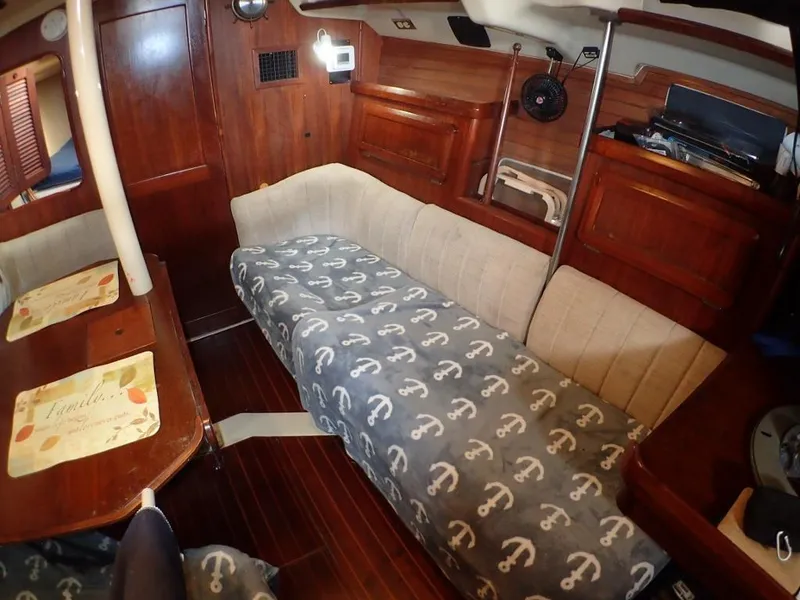 Slide: The Image of Interior of 1991 Hunter Legend 37.5 sailboat with cozy seating and wooden finishes. - 39