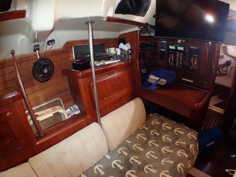 Slide: The Image of Interior of 1991 Hunter Legend 37.5 sailboat with cozy seating and navigation equipment. - 40