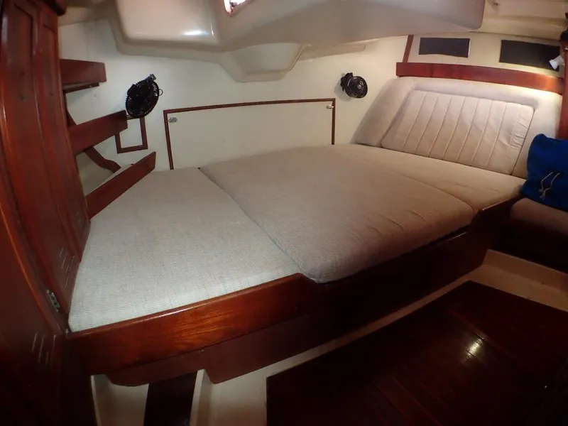 Slide: The Image of Interior cabin of 1991 Hunter Legend 37.5 sailboat with cozy bed and wooden accents. - 43