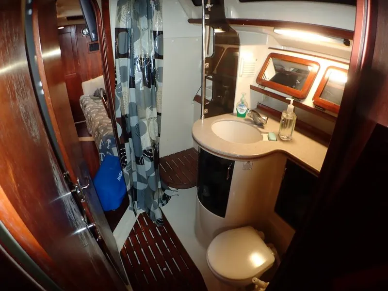 Slide: The Image of Interior of 1991 Hunter Legend 37.5 sailboat bathroom with sink and toilet. - 47
