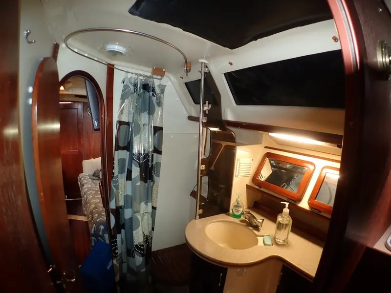Slide: The Image of Interior of 1991 Hunter Legend 37.5 sailboat bathroom with shower and sink. - 48