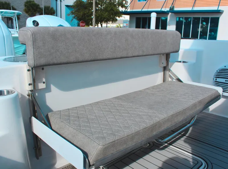 Slide: The Image of 2023 Seapro 259 boat with a foldable gray bench seat. - 10