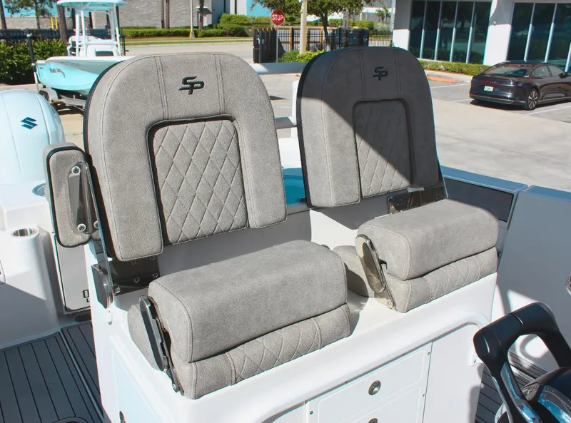 Slide: The Image of 2023 Seapro 259 boat seats with gray upholstery and diamond stitching. - 12