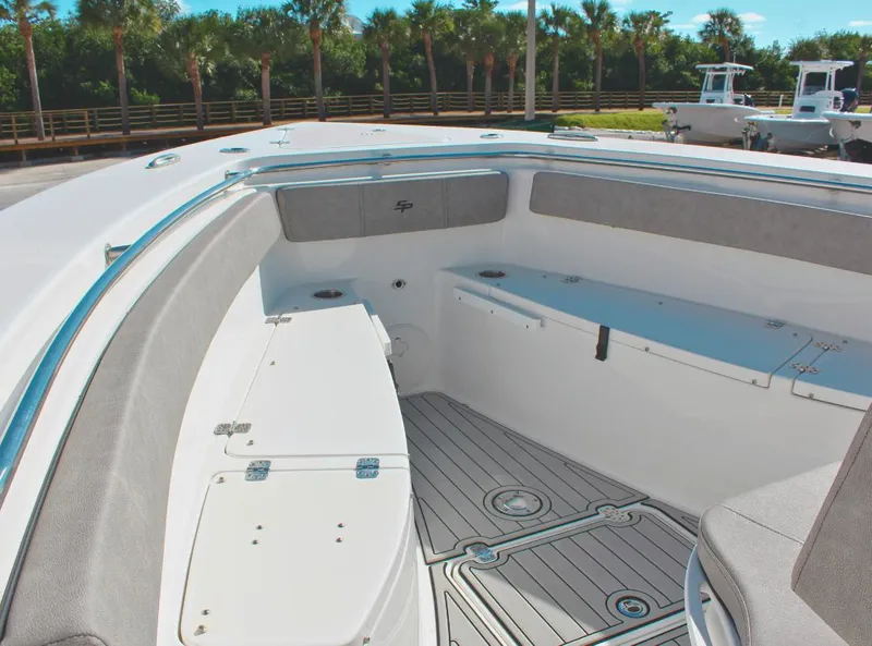 Slide: The Image of 2023 Seapro 259 boat interior with cushioned seating and storage compartments. - 17