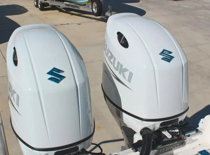 Slide: The Image of Twin Suzuki outboard motors on a 2023 Seapro 259 boat. - 23