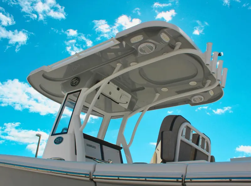 Slide: The Image of 2023 Seapro 259 boat with T-top against a bright blue sky. - 4