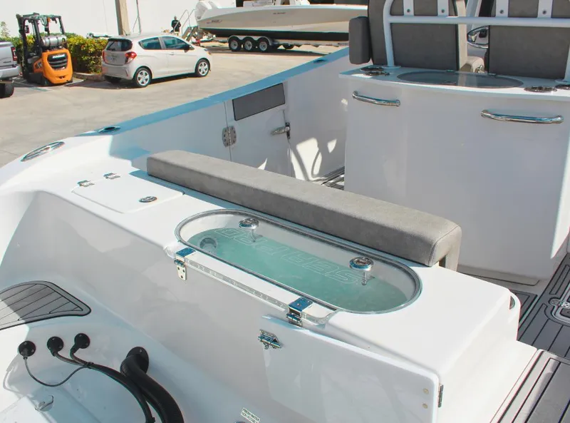 Slide: The Image of 2023 Seapro 259 boat interior with seating and storage compartments. - 6