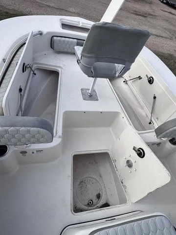 Slide: The Image of 2025 Carolina Skiff 22 Ultra Elite boat interior with storage compartments and seating. - 10