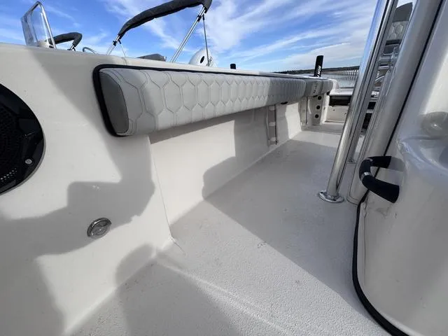 Slide: The Image of 2025 Carolina Skiff 22 Ultra Elite boat interior with cushioned seating and sleek design. - 14