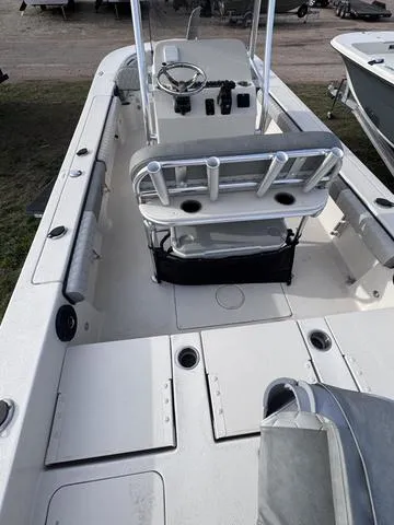 Slide: The Image of 2025 Carolina Skiff 22 Ultra Elite boat interior with seating and steering console. - 17