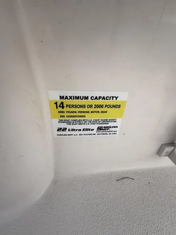Slide: The Image of 2025 Carolina Skiff 22 Ultra Elite capacity label: 14 persons or 2006 pounds. - 23
