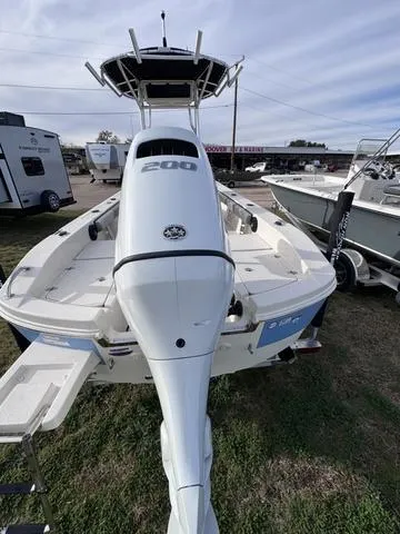 Slide: The Image of 2025 Carolina Skiff 22 Ultra Elite boat with powerful outboard motor, displayed outdoors. - 3