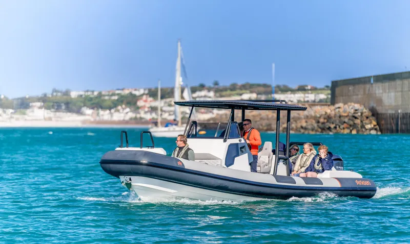 The Image of Arksen 8 boat cruising in clear blue waters, 2025 model. - 1