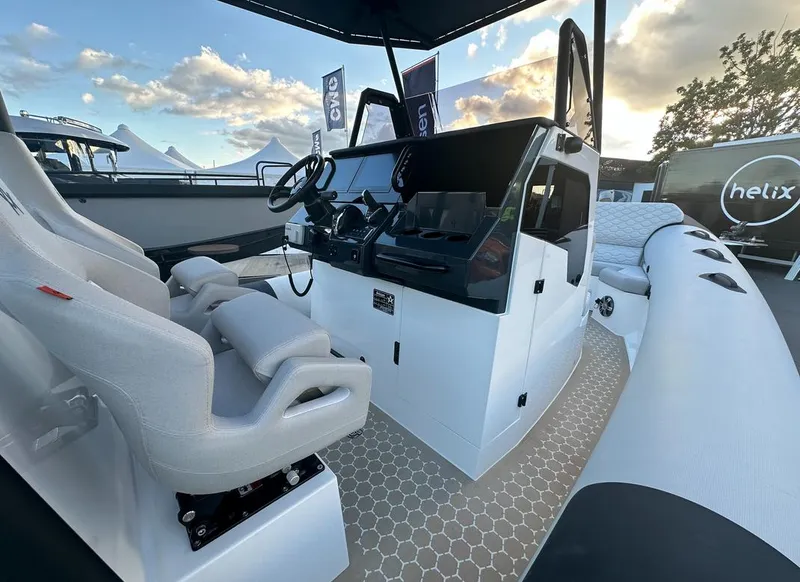 Slide: The Image of 2025 Arksen 8 boat interior with modern helm and seating. - 2