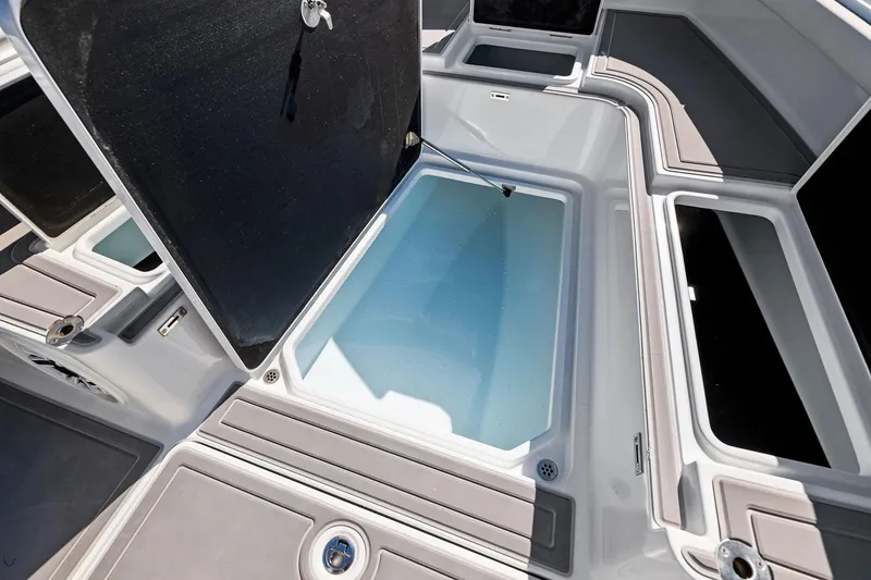Slide: The Image of 2021 Barker Boatworks 26 Open deck with storage compartments open. - 14