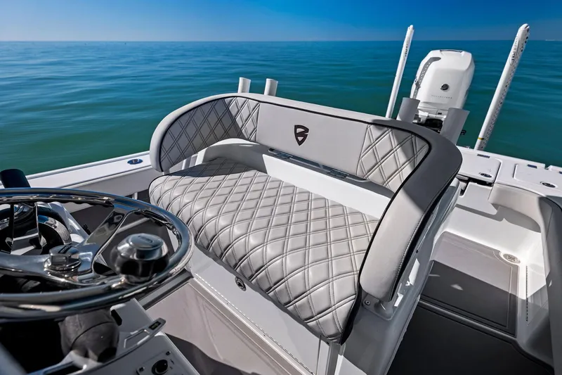 Slide: The Image of Luxury seating on 2021 Barker Boatworks 26 Open, ocean backdrop. - 18