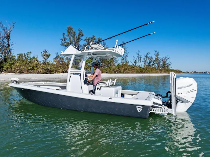 Slide: The Image of 2021 Barker Boatworks 26 Open on calm water, featuring sleek design and fishing equipment. - 2