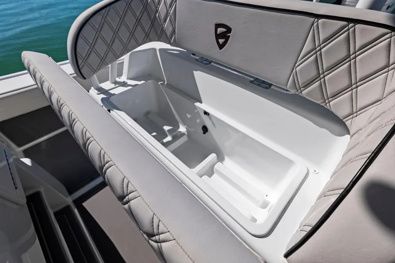 Slide: The Image of 2021 Barker Boatworks 26 Open interior storage compartment with quilted upholstery. - 20