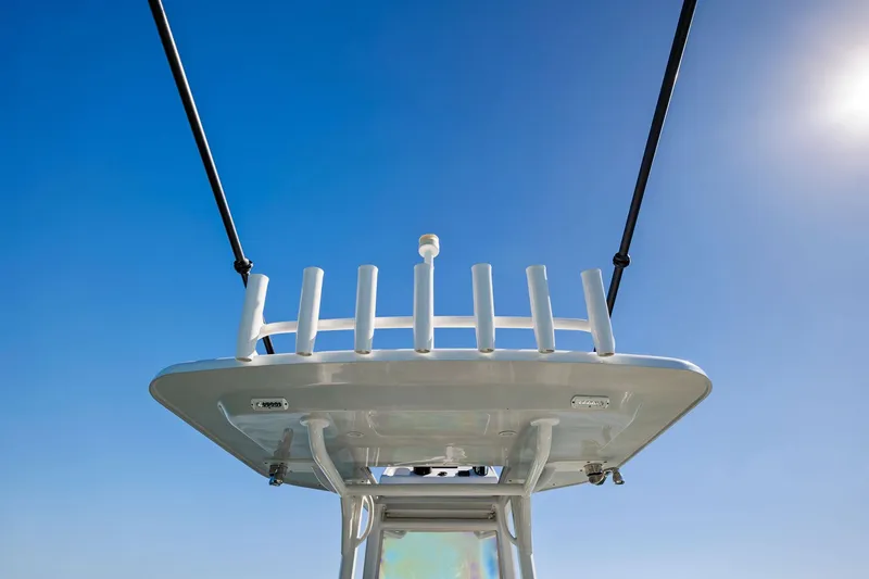 Slide: The Image of Barker Boatworks 26 Open 2021, T-top view against clear blue sky. - 24