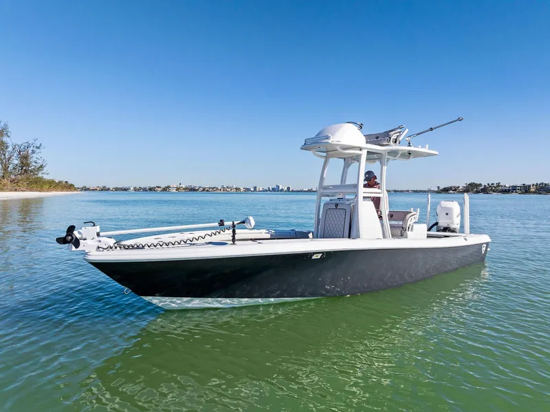 Slide: The Image of 2021 Barker Boatworks 26 Open cruising on clear blue water. - 3