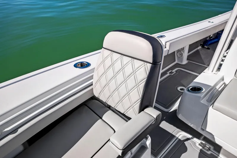 Slide: The Image of Barker Boatworks 26 Open 2021, featuring luxurious seating and sleek design on calm waters. - 9