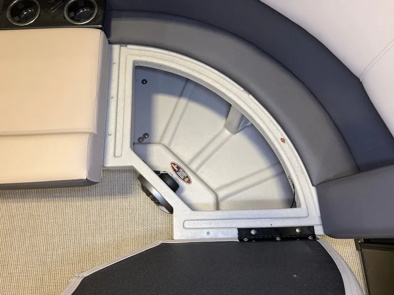 Slide: The Image of Close-up of a seating area with gray and beige upholstery on a Harris Cruiser 250 boat. - 8