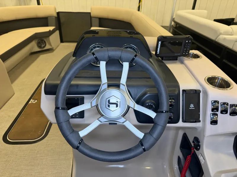Slide: The Image of The image shows the helm of a 2025 Harris Cruiser 250 with modern controls. - 13