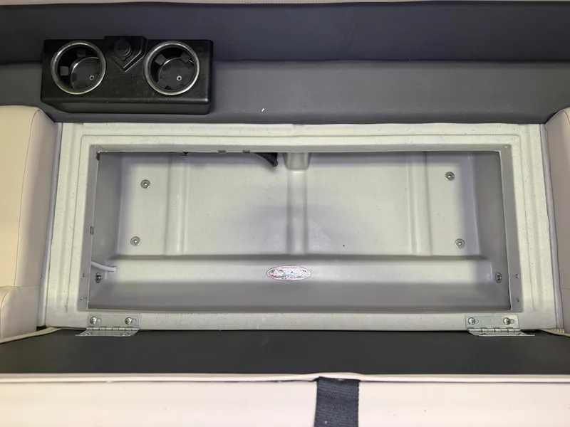 Slide: The Image of Interior view of a 2025 Harris Cruiser 250 with cup holders and storage space. - 4