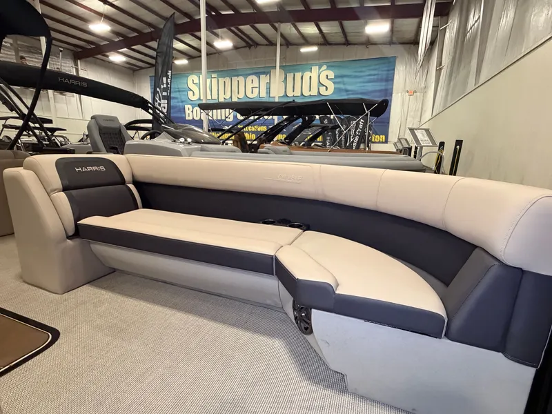 Slide: The Image of The image shows the interior of a 2025 Harris Cruiser 250 with beige and gray seating. - 6