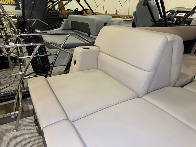 Slide: The Image of The image shows the interior of a 2025 Harris Cruiser 250 with beige upholstery. - 33