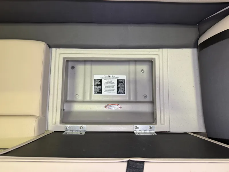 Slide: The Image of A storage compartment in the 2025 Harris Cruiser 250 with an information label. - 5