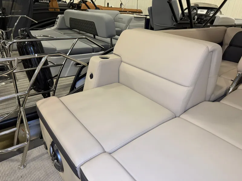 Slide: The Image of The image shows the beige upholstery of a 2025 Harris Cruiser 250. - 36