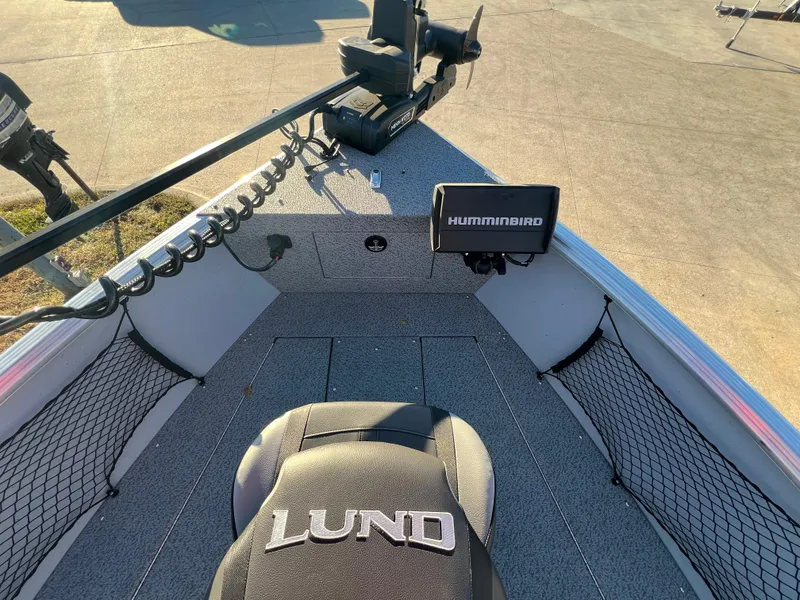 Slide: The Image of 2024 Lund 2075 Alaskan Sport boat interior with Humminbird fish finder. - 12